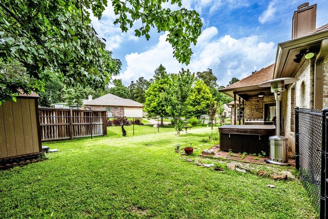 2312 W Green Briar Dr, Huntsville, TX 77340 - view of yard with a hot tub and central air condition unit
