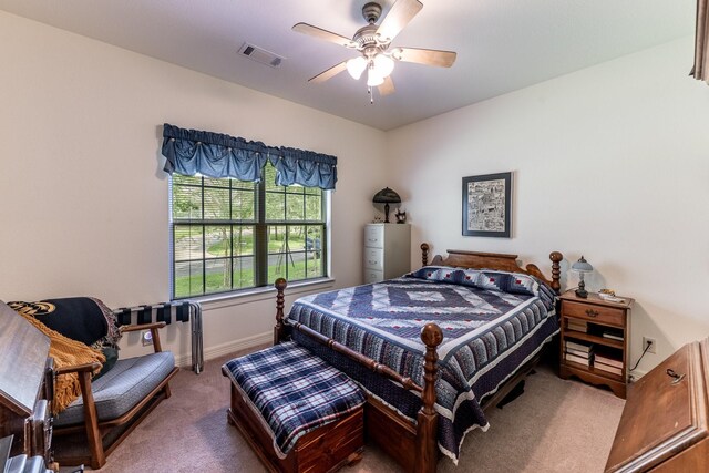 2312 W Green Briar Dr, Huntsville, TX 77340 - bedroom with carpet floors, baseboards, and ceiling fan