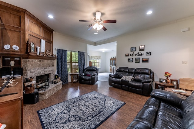 2312 W Green Briar Dr, Huntsville, TX 77340 - living area with ceiling fan, wood finished floors, a fireplace, crown molding, and recessed lighting