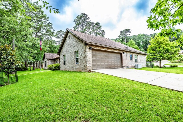 2312 W Green Briar Dr, Huntsville, TX 77340 - view of side of home with brick siding, cooling unit, driveway, and an attached garage