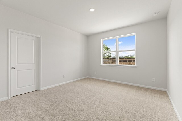 1027 Rosewood Trl, Beasley, TX 77417 - carpeted spare room featuring baseboards and a smoke detector