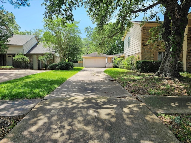 16438 Glenshannon Dr, Houston, TX 77059 - view of front of house with brick siding, a front yard, driveway, and a garage