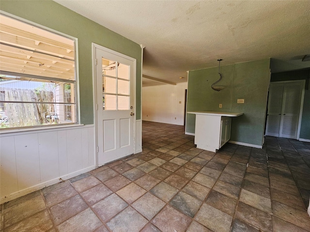 16438 Glenshannon Dr, Houston, TX 77059 - unfurnished room with dark stone finish flooring and a textured ceiling