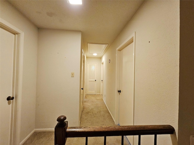 16438 Glenshannon Dr, Houston, TX 77059 - hall featuring attic access, light carpet, a textured ceiling, and a textured wall