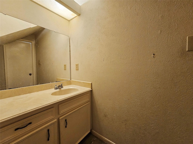 16438 Glenshannon Dr, Houston, TX 77059 - bathroom with vanity and a textured wall