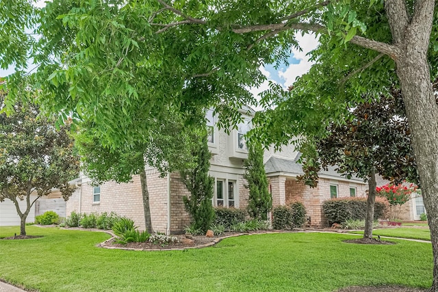 16418 Crawford St, Jersey Village, TX 77040 - view of property hidden behind natural elements featuring brick siding, a front lawn, and a shingled roof
