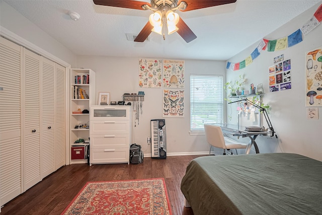 16418 Crawford St, Jersey Village, TX 77040 - bedroom with dark wood-type flooring, ceiling fan, and a closet