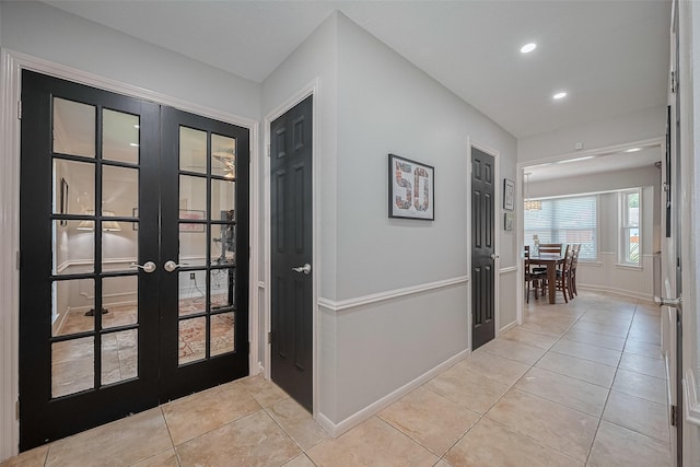 16418 Crawford St, Jersey Village, TX 77040 - hall with french doors, light tile patterned floors, and recessed lighting