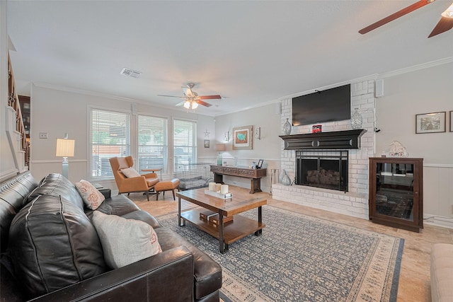 16418 Crawford St, Jersey Village, TX 77040 - living area featuring ceiling fan, crown molding, a fireplace, and wainscoting