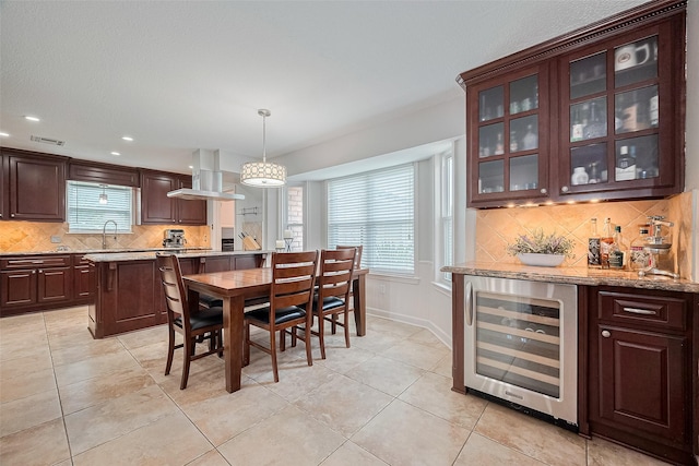 16418 Crawford St, Jersey Village, TX 77040 - dining area with beverage cooler, a dry bar, recessed lighting, and light tile patterned floors