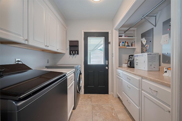 16418 Crawford St, Jersey Village, TX 77040 - laundry area with washer and clothes dryer and light tile patterned flooring