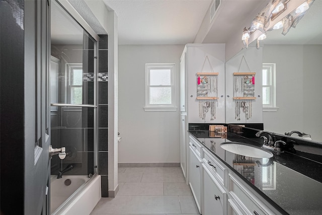 16418 Crawford St, Jersey Village, TX 77040 - bathroom with vanity, tile patterned flooring, and enclosed tub / shower combo