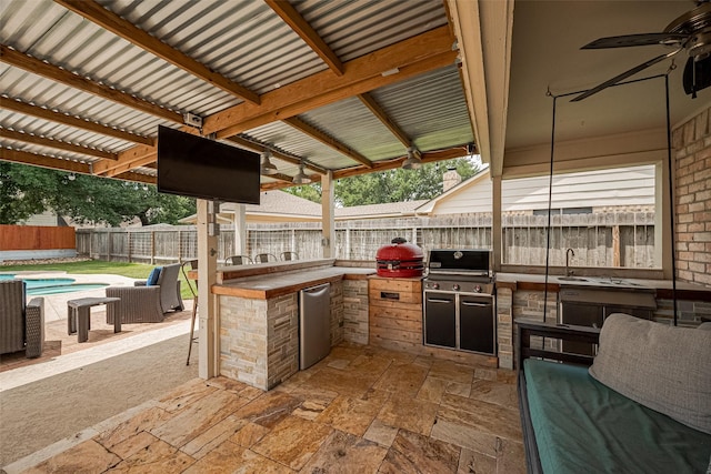16418 Crawford St, Jersey Village, TX 77040 - fenced backyard featuring an outdoor kitchen, a ceiling fan, and a patio