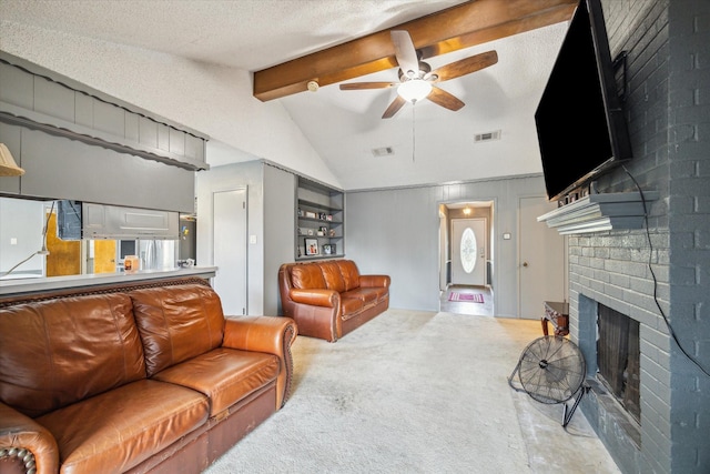 1105 Mesquite St, Baytown, TX 77521 - living room with carpet flooring, ceiling fan, and a fireplace
