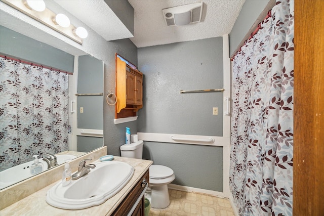 1105 Mesquite St, Baytown, TX 77521 - bathroom featuring vanity, tile patterned floors, a shower with shower curtain, and a textured wall