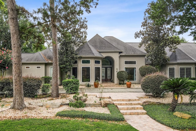 51 Wincrest Falls Dr, Cypress, TX 77429 - french country style house with stucco siding, french doors, and roof with shingles