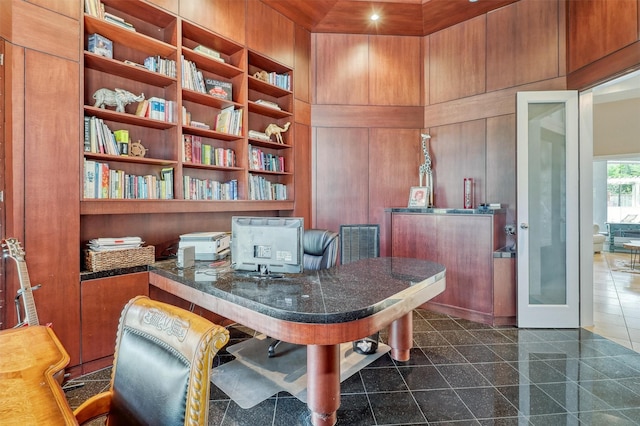 51 Wincrest Falls Dr, Cypress, TX 77429 - office area with granite tiled floors, wood walls, and built in shelves