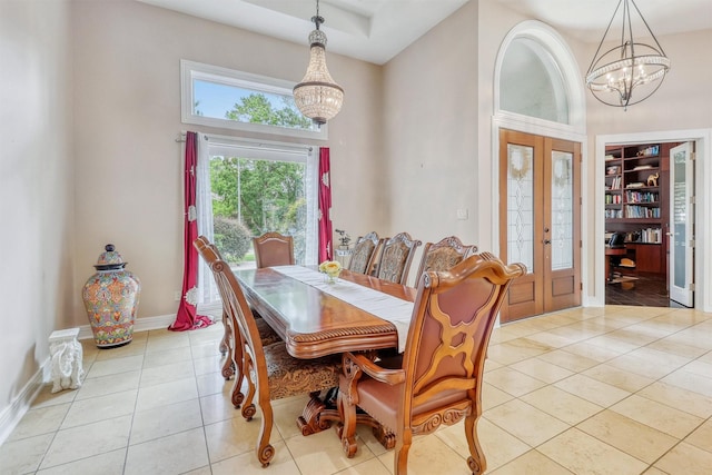 51 Wincrest Falls Dr, Cypress, TX 77429 - dining area featuring a chandelier, a high ceiling, french doors, light tile patterned flooring, and an office area