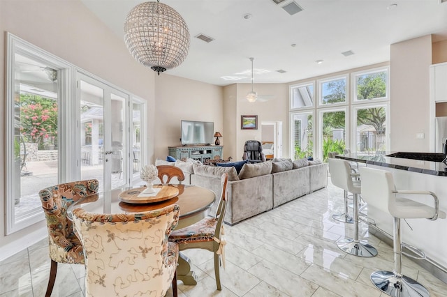 51 Wincrest Falls Dr, Cypress, TX 77429 - dining room featuring french doors, a chandelier, and light marble finish flooring