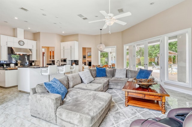 51 Wincrest Falls Dr, Cypress, TX 77429 - living room with recessed lighting, ceiling fan, and french doors