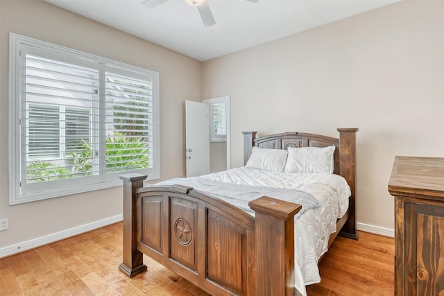 51 Wincrest Falls Dr, Cypress, TX 77429 - bedroom with light wood-style floors and a ceiling fan