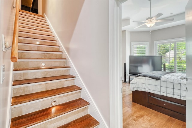 51 Wincrest Falls Dr, Cypress, TX 77429 - staircase featuring ceiling fan and wood finished floors