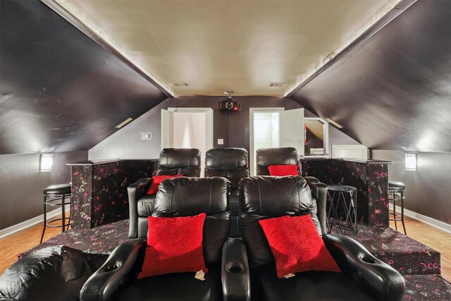 51 Wincrest Falls Dr, Cypress, TX 77429 - home theater room with wood finished floors and vaulted ceiling