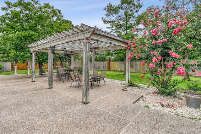 51 Wincrest Falls Dr, Cypress, TX 77429 - fenced backyard with a pergola, outdoor dining space, and a patio