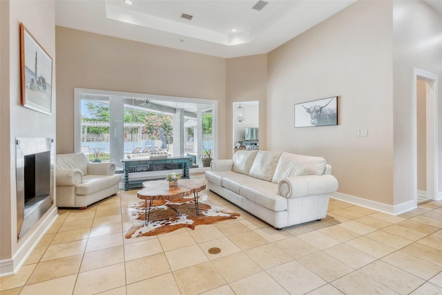 51 Wincrest Falls Dr, Cypress, TX 77429 - living area with a towering ceiling, light tile patterned floors, recessed lighting, and a raised ceiling