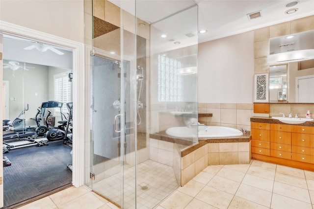 51 Wincrest Falls Dr, Cypress, TX 77429 - bathroom featuring vanity, a bath, a ceiling fan, tile patterned floors, and a stall shower