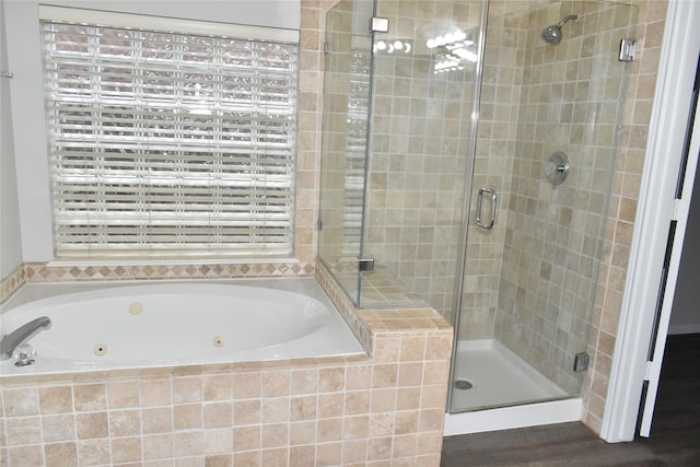 11111 Sprucedale Ct, Houston, TX 77070 - full bath featuring a shower stall, a whirlpool tub, and wood finished floors