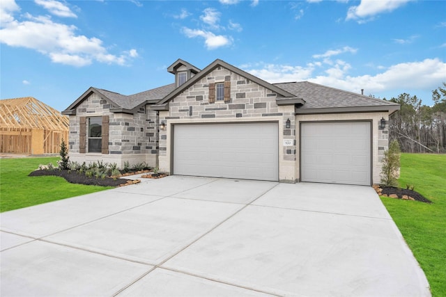520 Barton Place Dr, Cleveland, TX 77327 - french country home with stone siding, a garage, and a front yard