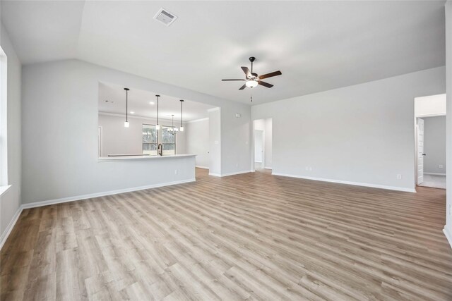 520 Barton Place Dr, Cleveland, TX 77327 - unfurnished living room with ceiling fan, light wood-style floors, baseboards, and recessed lighting