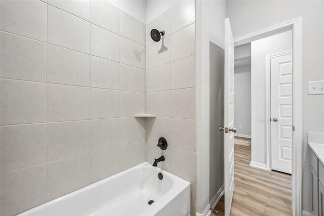 520 Barton Place Dr, Cleveland, TX 77327 - bathroom featuring wood finished floors, shower / tub combination, baseboards, and vanity