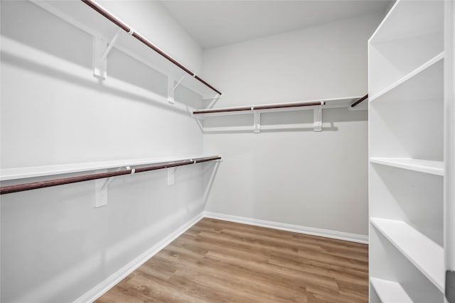 520 Barton Place Dr, Cleveland, TX 77327 - walk in closet with light wood finished floors