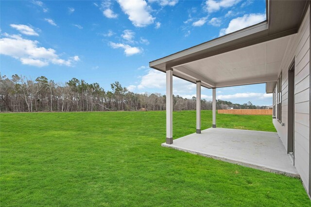 520 Barton Place Dr, Cleveland, TX 77327 - view of green lawn featuring a patio