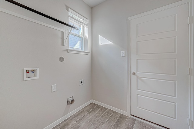 210 Emerald Thicket Ln, Huffman, TX 77336 - laundry room featuring electric dryer hookup, baseboards, hookup for a washing machine, and wood finish floors