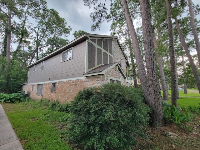 5211 Alamosa Ln, Spring, TX 77379 - view of home's exterior featuring brick siding