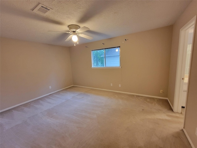 5211 Alamosa Ln, Spring, TX 77379 - unfurnished room with ceiling fan, light carpet, and a textured ceiling