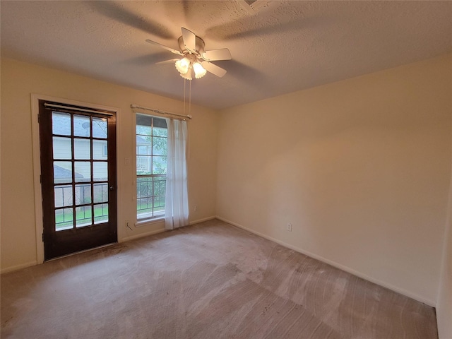 5211 Alamosa Ln, Spring, TX 77379 - spare room featuring a ceiling fan, light colored carpet, and a textured ceiling
