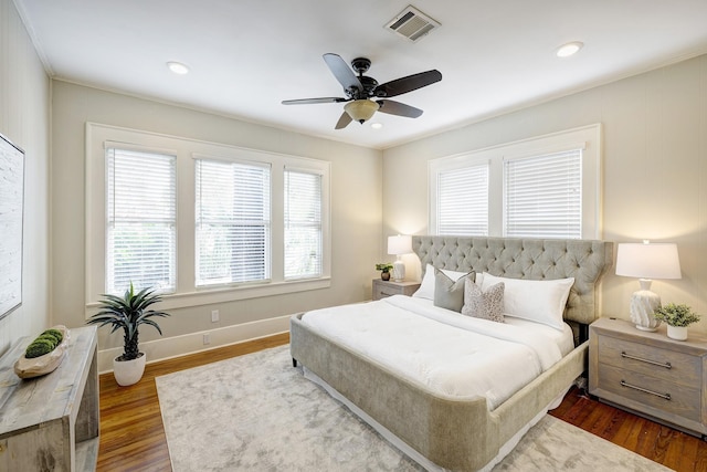 1639 Hawthorne St, Houston, TX 77006 - bedroom with multiple windows, dark wood-type flooring, baseboards, ceiling fan, and recessed lighting
