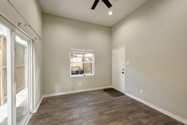 1639 Hawthorne St, Houston, TX 77006 - spare room with ceiling fan, dark wood-style flooring, baseboards, and a high ceiling
