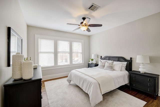1639 Hawthorne St, Houston, TX 77006 - bedroom featuring baseboards, dark wood-style floors, and a ceiling fan