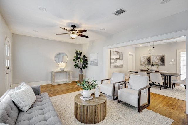 1639 Hawthorne St, Houston, TX 77006 - living room featuring light wood finished floors, ceiling fan, baseboards, and recessed lighting