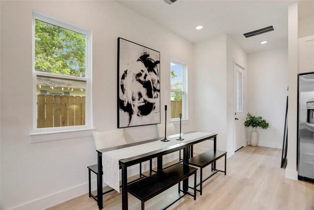 311 Marcella St Unit A, Houston, TX 77091 - dining room with light wood finished floors, baseboards, and recessed lighting