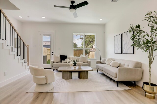 311 Marcella St Unit A, Houston, TX 77091 - living area featuring wood finished floors, a ceiling fan, stairway, baseboards, and recessed lighting