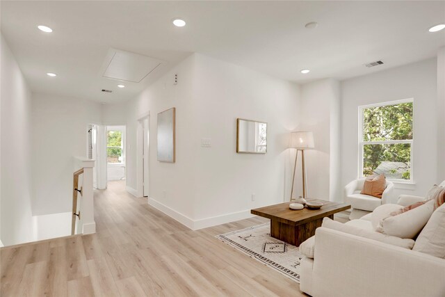 311 Marcella St Unit A, Houston, TX 77091 - living room featuring attic access, recessed lighting, light wood-style floors, and baseboards