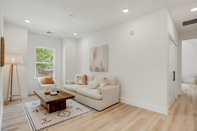 311 Marcella St Unit A, Houston, TX 77091 - living area with light wood finished floors, recessed lighting, and baseboards