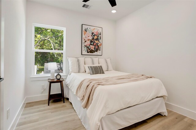 311 Marcella St Unit A, Houston, TX 77091 - bedroom featuring light wood-style flooring, baseboards, ceiling fan, and recessed lighting
