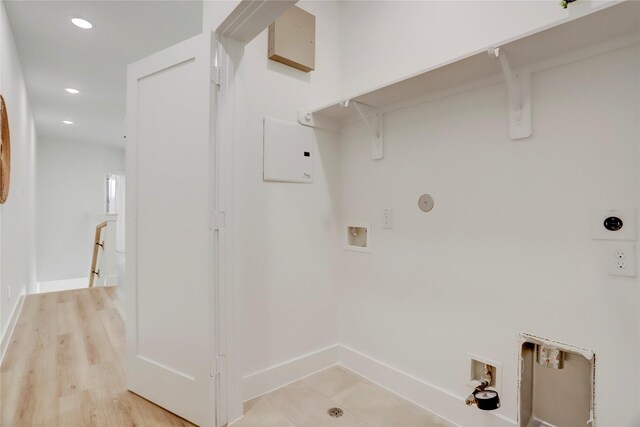 311 Marcella St Unit A, Houston, TX 77091 - washroom with washer hookup, hookup for a gas dryer, electric dryer hookup, baseboards, and recessed lighting